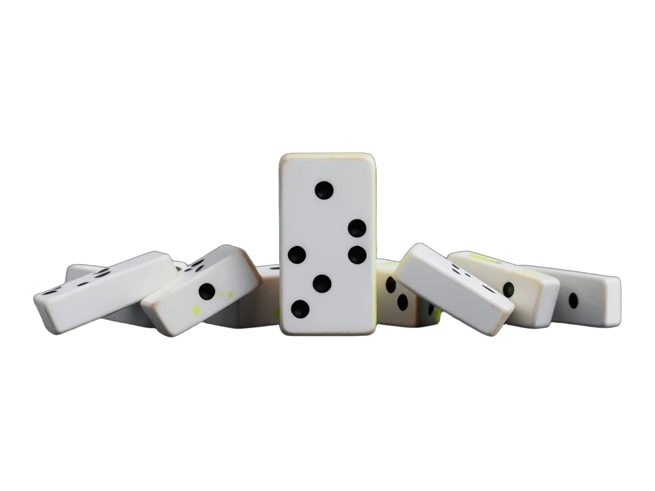 A single metal key lying apart from a tight cluster of identical keys, next to a sealed white envelope resting closed and flat.